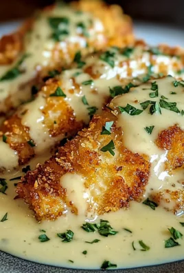 Crispy Parmesan Crusted Chicken with Creamy Garlic Sauce