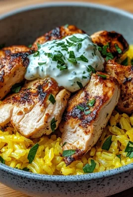 Zesty Lemon Herb Chicken Bowl with Golden Rice & Yogurt Sauce