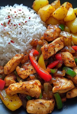 Spicy Stir-Fried Chicken with Bell Peppers, Rice & Crispy Potatoes